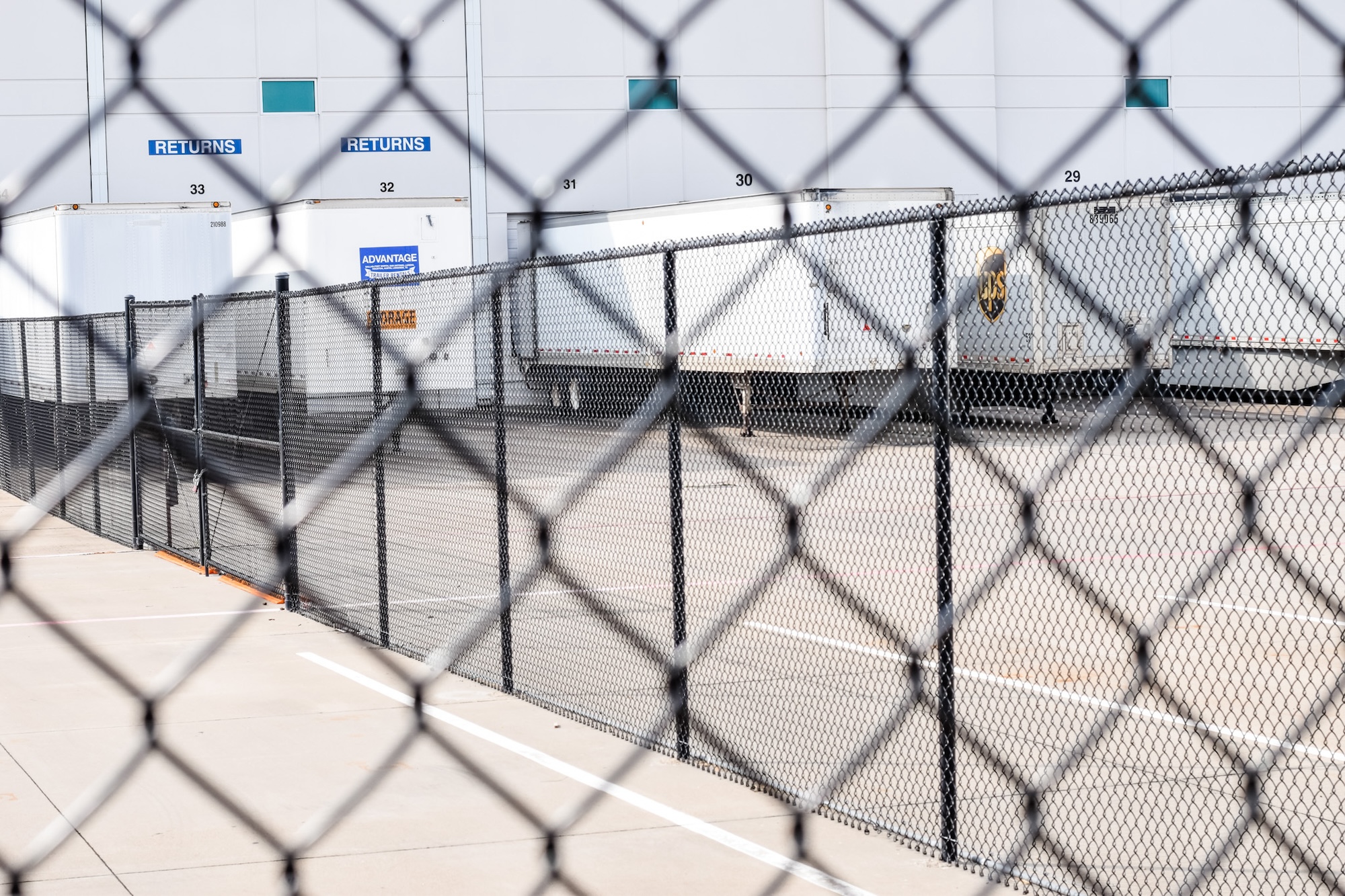 Commercial fencing around transportation yard by Gladiator Fence & Outdoors